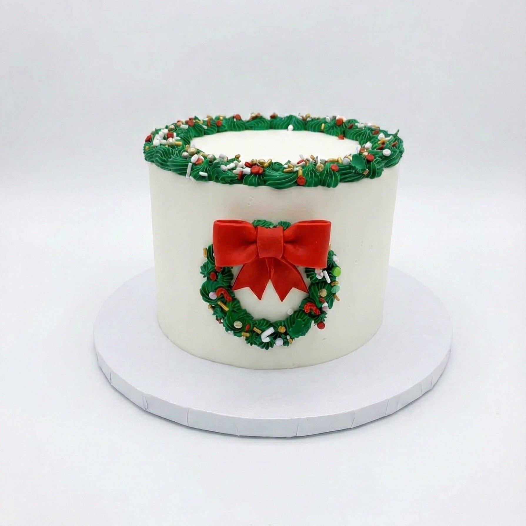 Holiday cake with a Wreath, bow, and ornaments